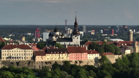 Aerial parallax shot of the churches in Tallinn city, summer evening in Estonia