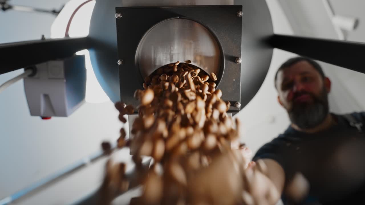 Coffee Beans Dropping from Roasting Machine