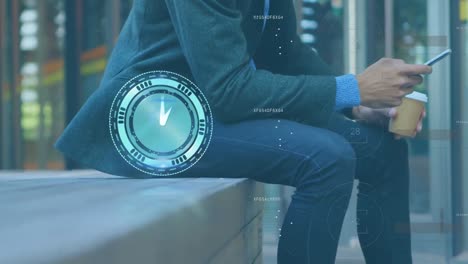 animation of clock and data processing over midsection of caucasian businessman using smartphone