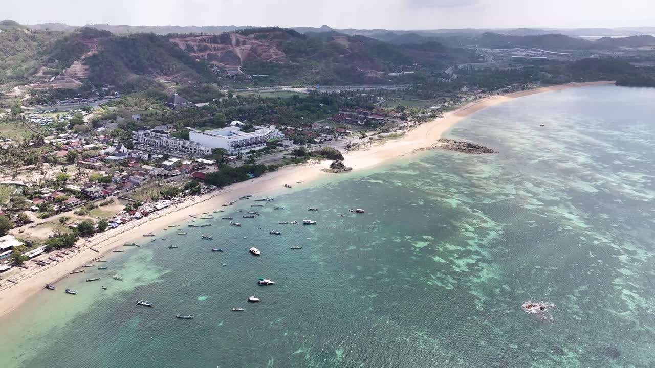 Aerial wide of Kuta Beach in Lombok Island of Indonesia. Tropical exotic travel destination.