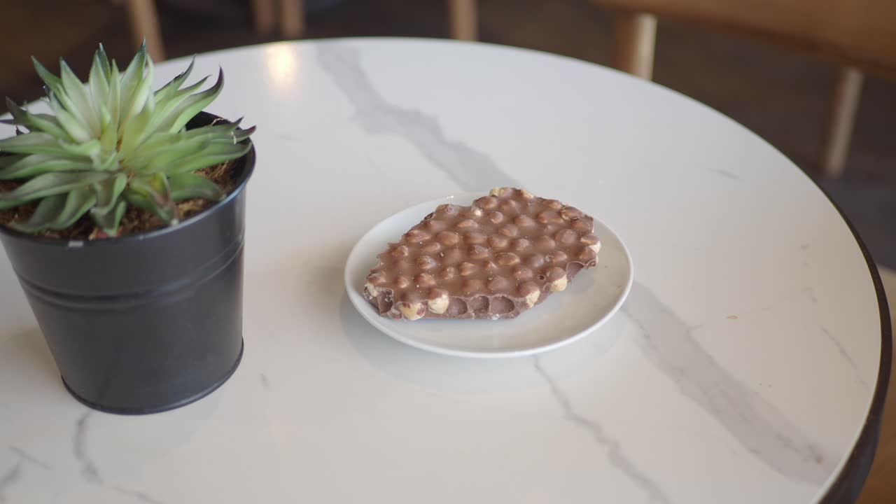 Chocolate with Hazelnuts on a Table
