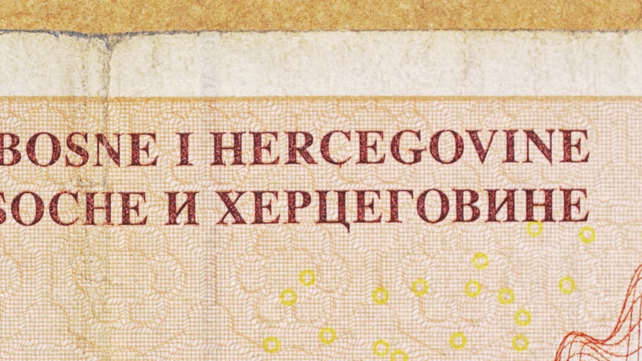 Macro pan over Bosnian mark showing Central Bank text in Latin and Cyrillic
