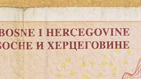macro pan over bosnian mark showing central bank text in latin and cyrillic