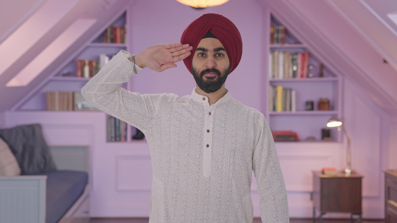 Uomo indiano sikh orgoglioso che saluta