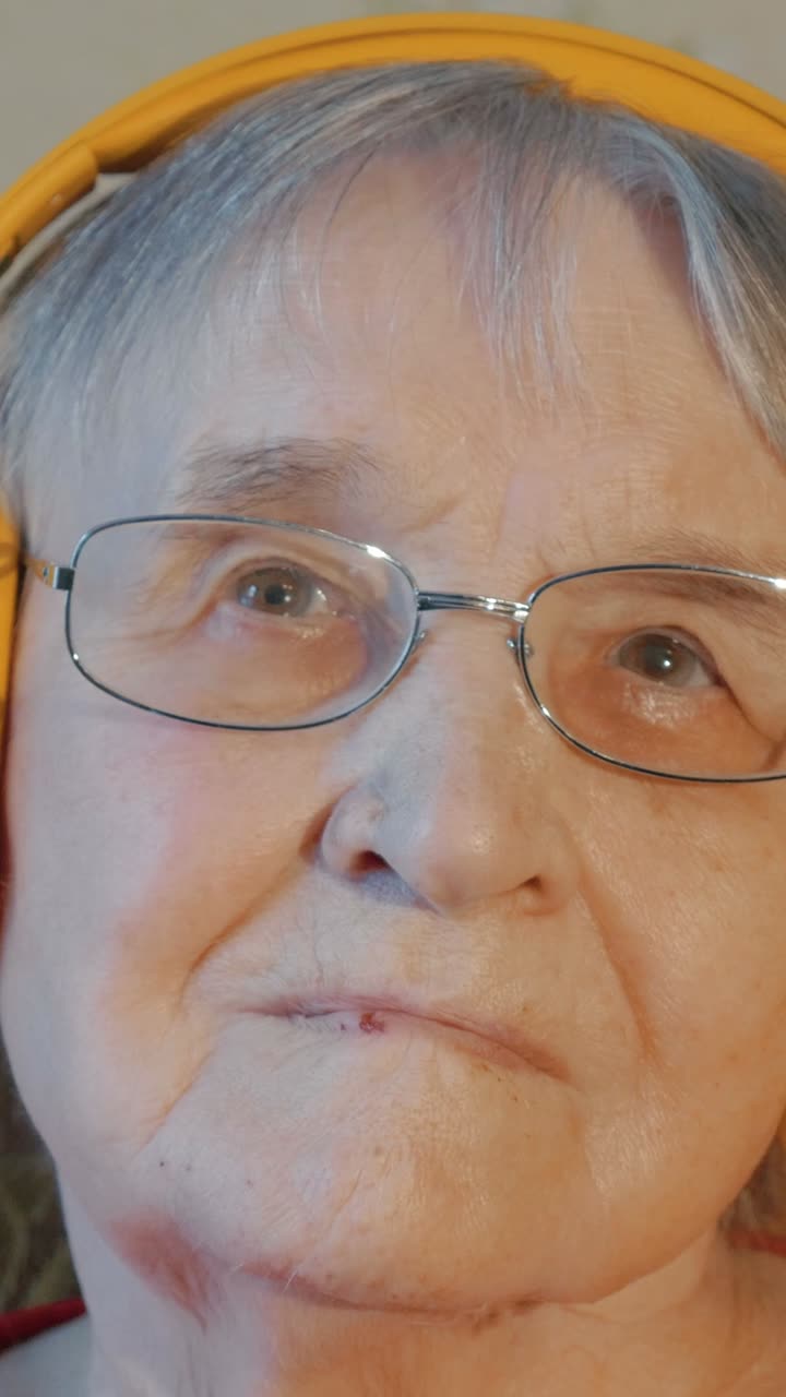 Close-up of an Elderly Woman with Headphones