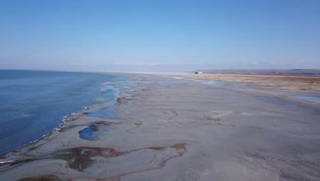 a beautiful morning on the shores of the great salt lake with the saltair concert venue in the background