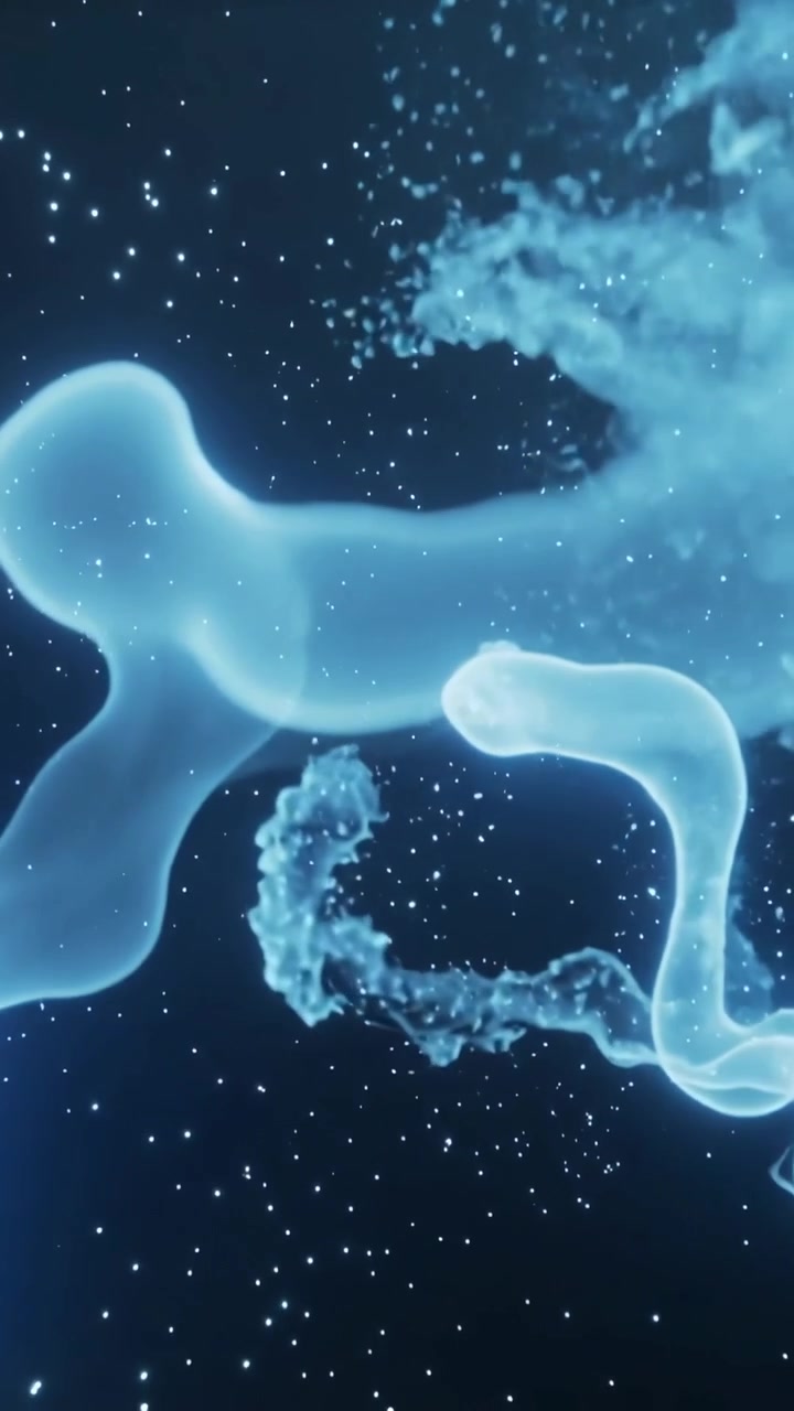 Video verticale: Una massa ciano-blu che si forma, allunga i suoi filamenti e rilascia sbuffi di vapore in un campo stellare.