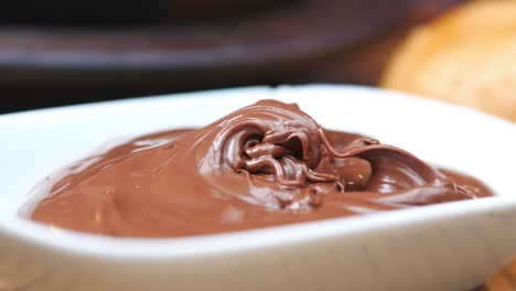 close up of chocolate spread in a white bowl