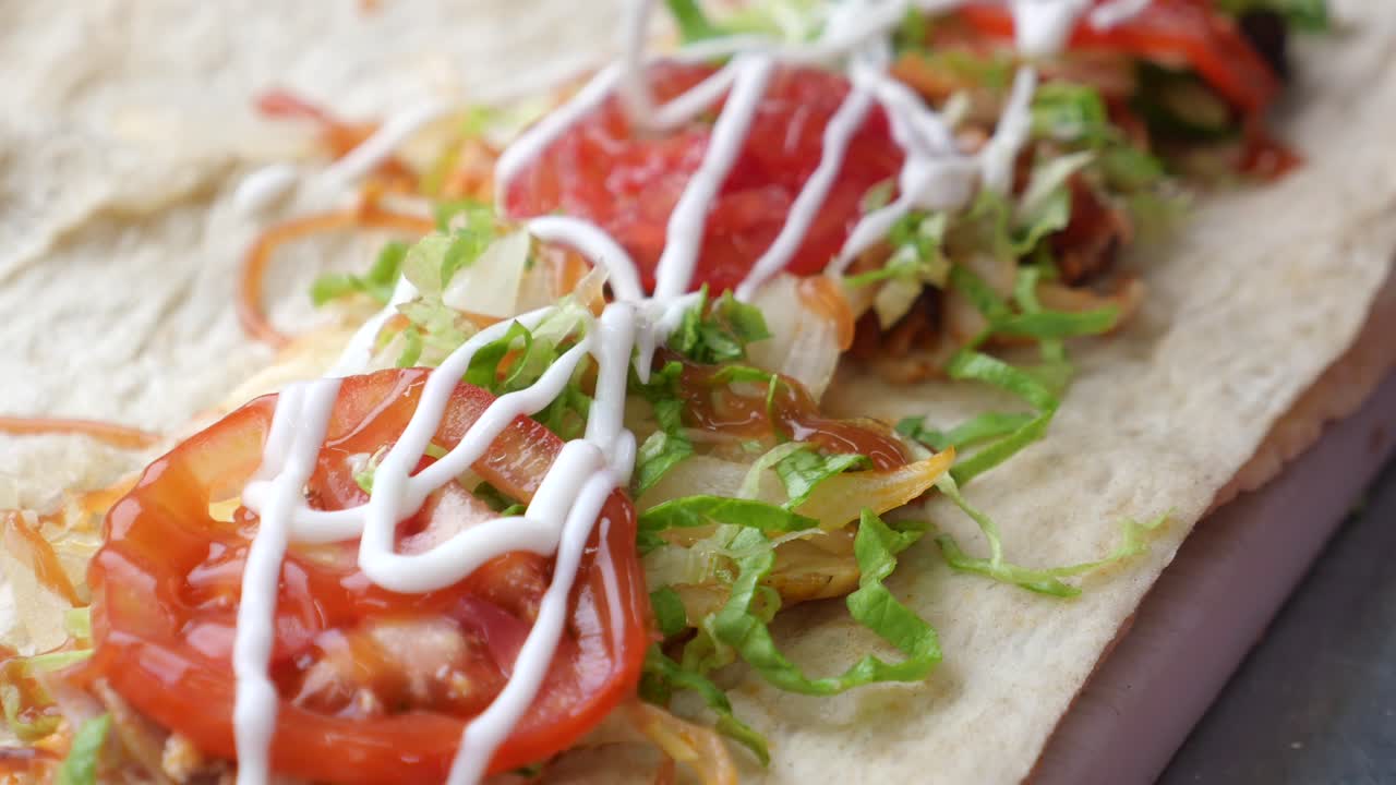 Shawarma wrap with tomato and lettuce