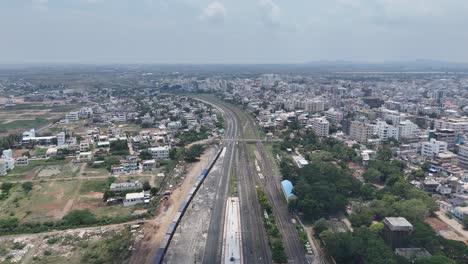 aerial view of a city in india with railway tracks