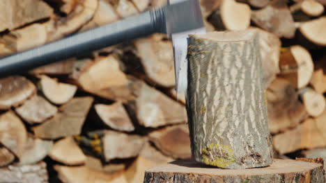 ax splits a log harvesting firewood slow motion video