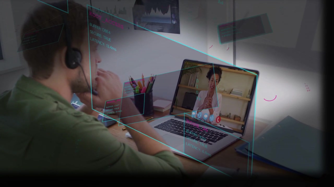 Video verticale: Uomo con cuffie che si china sul laptop, con un'interfaccia utente olografica che si illumina e evidenzia lo schermo per una chiamata di lavoro.