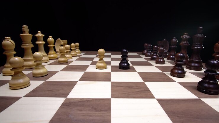 Attacking chess game between the white and black pieces