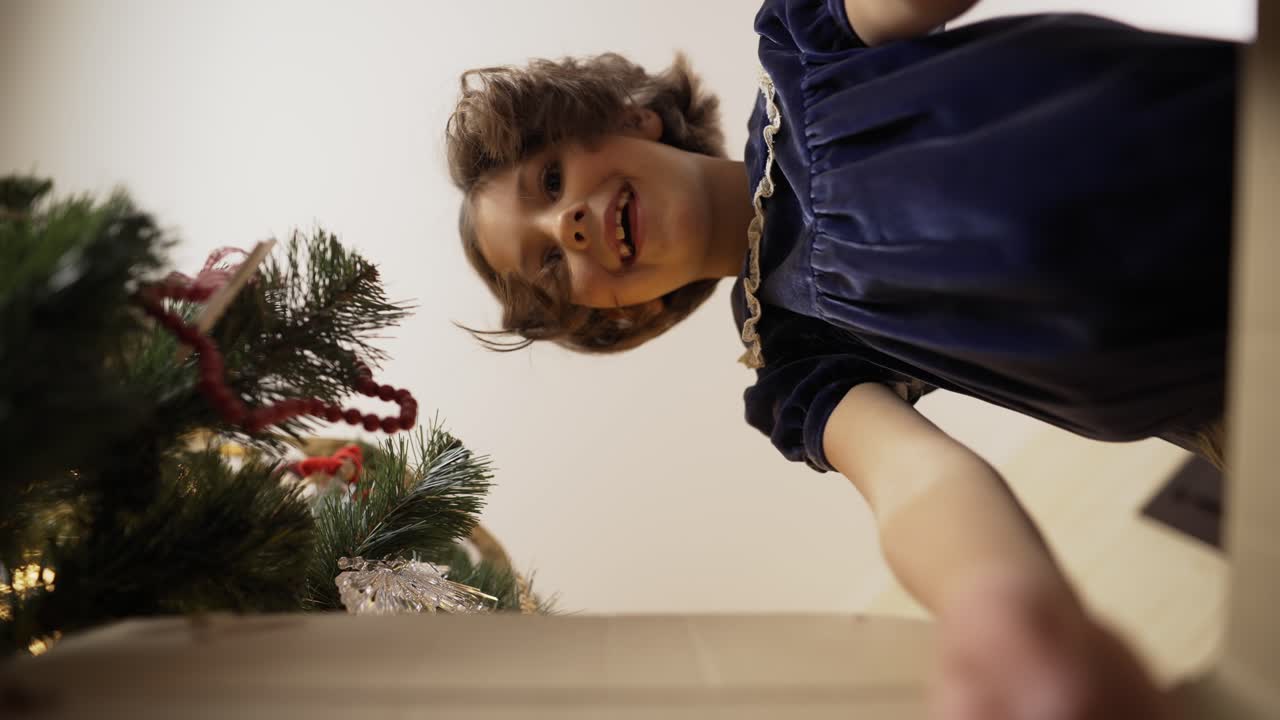 Excited little girl getting magic gift package on Christmas