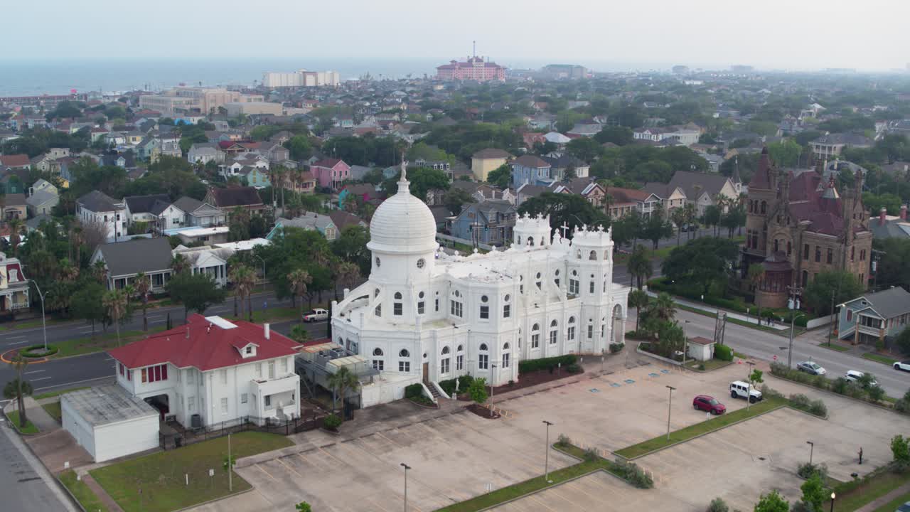 Drone view of Sacred Heart Catholic Church and surrounding area in Galveston, Texas