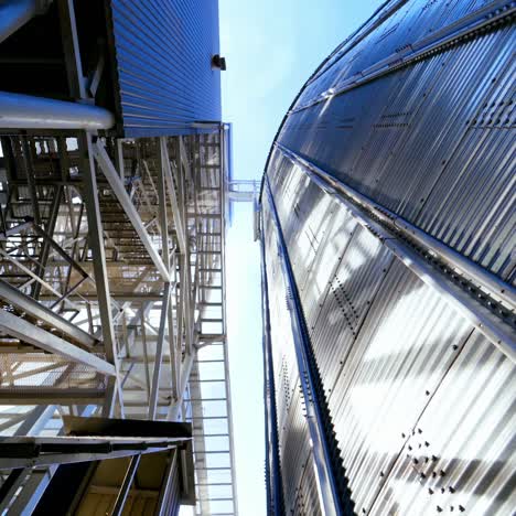 grain elevator. industrial granary. modern silo for processing grain. new equipment for agribusiness. close-up. view from below.