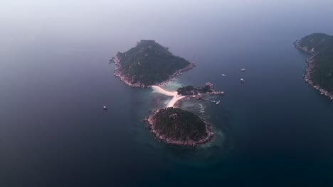 aerial view of tropical islands connected by a sandbar