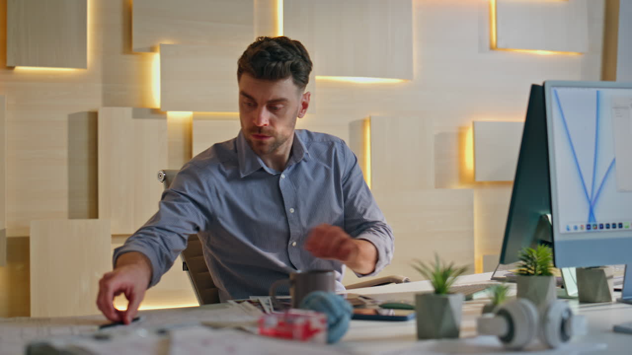 Office manager typing keyboard in office close up. Employee looking on papers