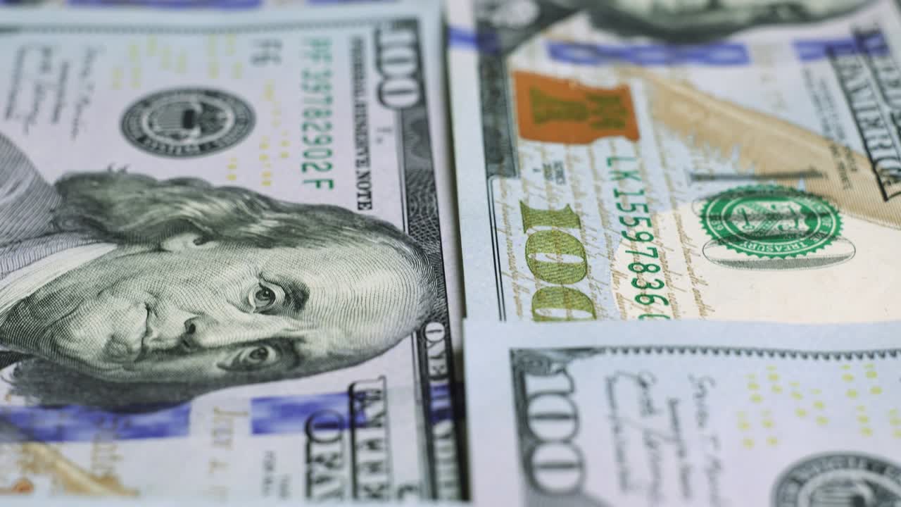 billetes de dólar estadounidense, dinero de papel, moneda de tasa de cambio. billetes de efectivo. el concepto de finanzas e inversión. cien dólares estadounidenses. economía empresarial