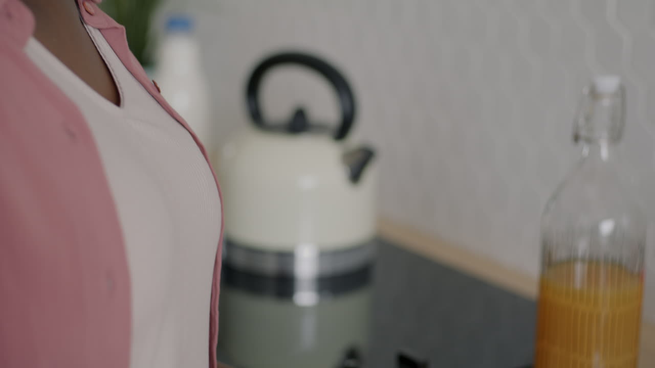 Woman preparing breakfast in the kitchen