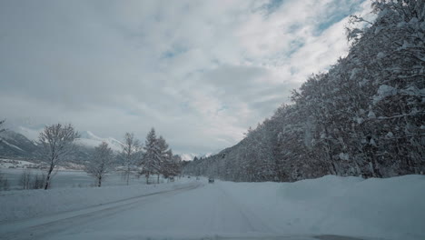 POV-video-of-driving-through-Norway's-Western-Fjords-in-winter,-showcasing-a-journey-along-snowy-roads