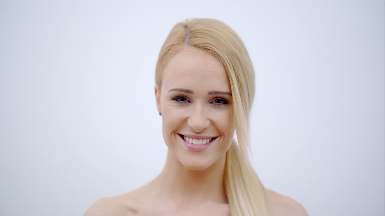 Smiling Bare Woman Touching her Face