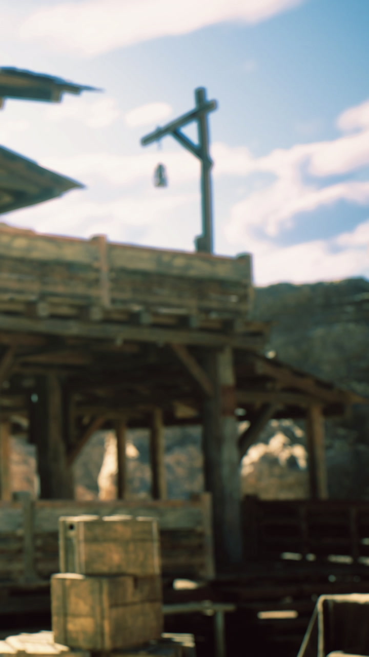 Rustic wooden structure stands in the warm glow of late afternoon sun