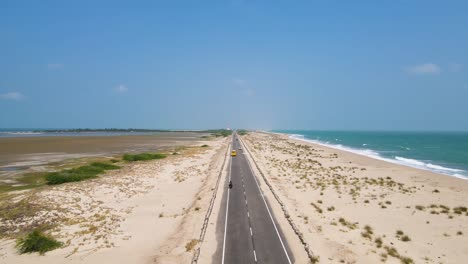 aerial drone shot over dhanushkodi’s abandoned town, highlighting the stark contrast between ruins and nature.