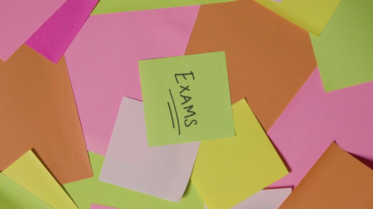 Education Concept Of Revolving Sticky Notes With Exams Written On Top Note