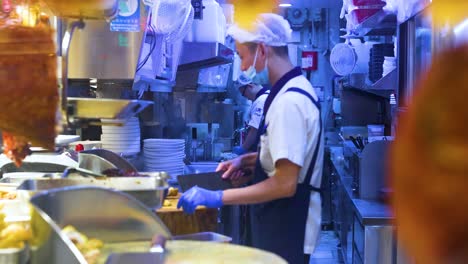 chef working in a busy hong kong kitchen