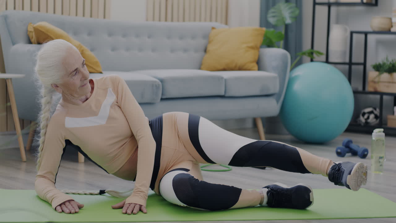 Senior Woman Doing Leg Exercise at Home