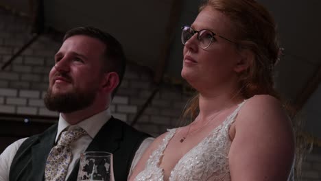 bride and groom enjoying a drink together at their wedding reception