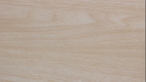 stop motion - top view of empty ceramic dip sauce bowl isolated on wood table background