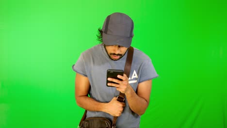 indian tourist try to find the way on road with green background - green screen