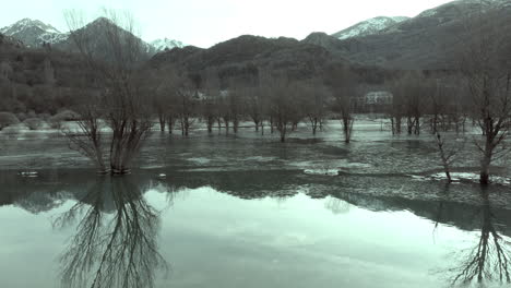 frozen river landscape with mountain reflection