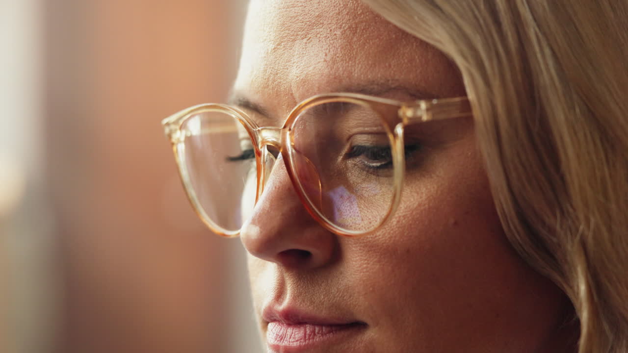 Close-up of Woman in Glasses Looking at Screen