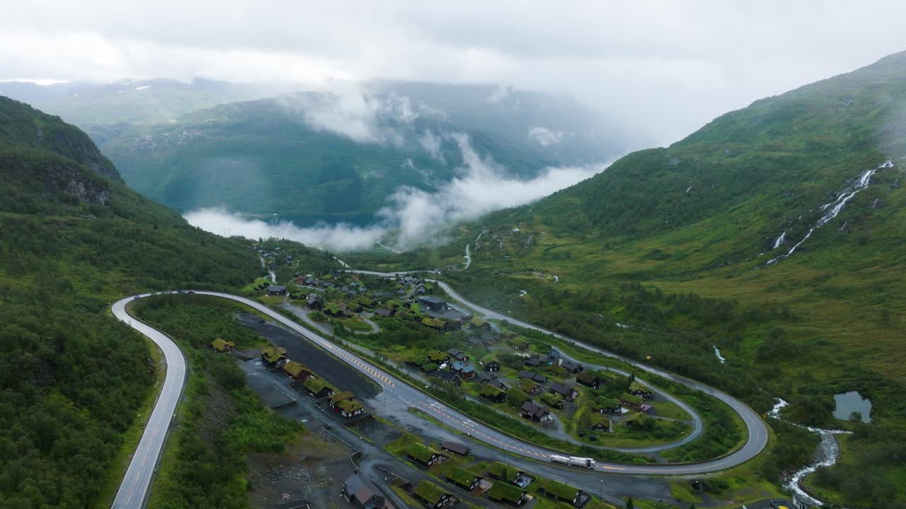 Røldal ski center on rainy summer day, drone ascend