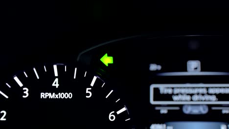 turn signal indicator on car's dashboard