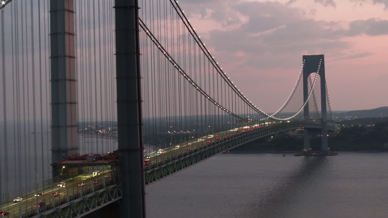 Aerial view of the Verrazzano-Narrows Bridge at night. Shot in Brooklyn looking towards Staten Island