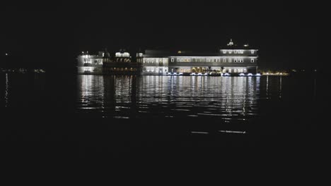 night view of unique architecture at lake city with dramatic lighting from unique perspective video is taken at udaipur rajasthan india.