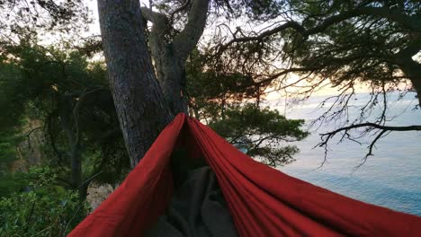 traveler watch morning mediterranean paradise sunrise from hammock contact nature vacation camping peaceful adventure medium shot