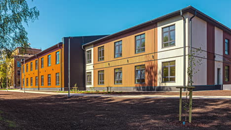 Exterior-view-of-wood-container-house-which-is-a-local-school-at-daytime-in-timelapse