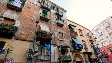 aged facade with balconies and laundry