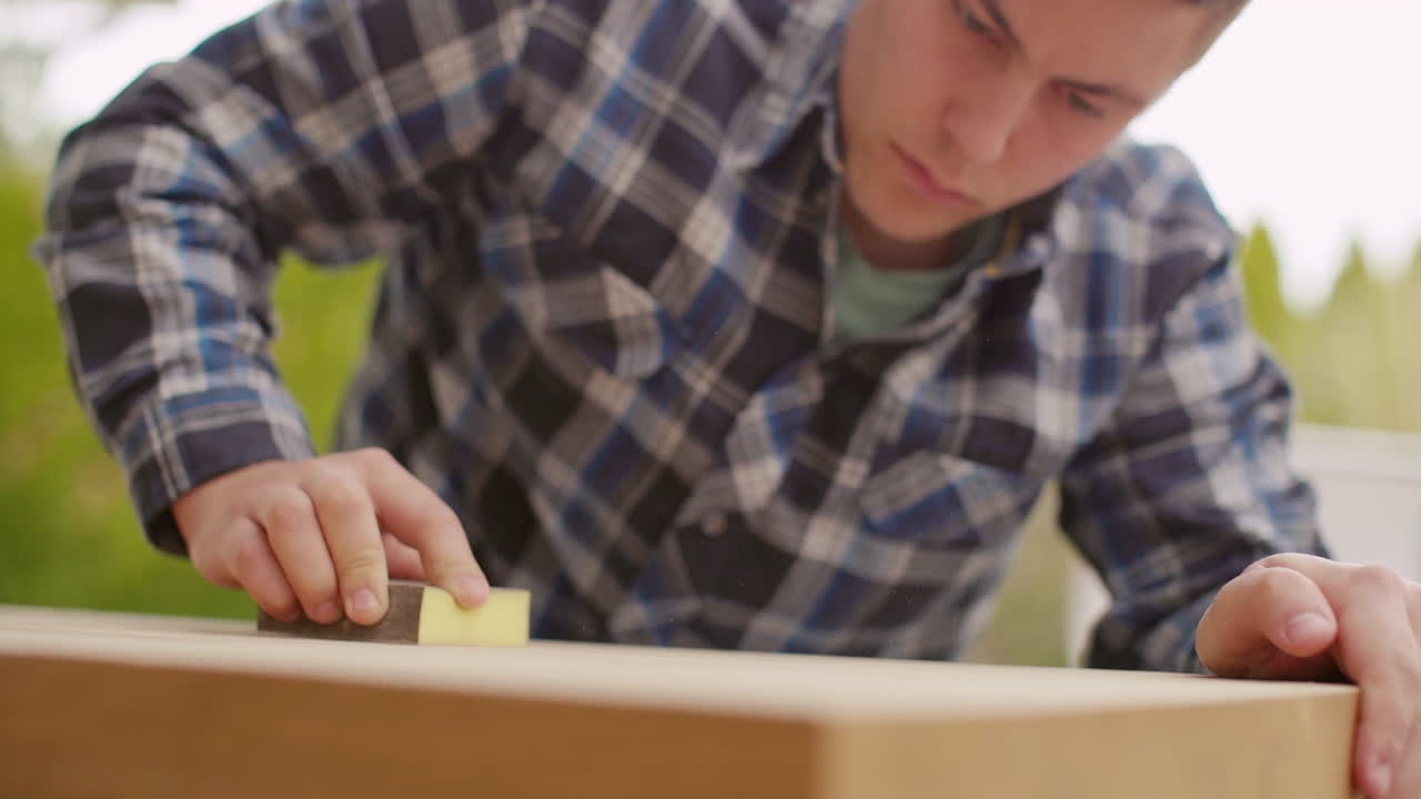 Man Sanding Wood