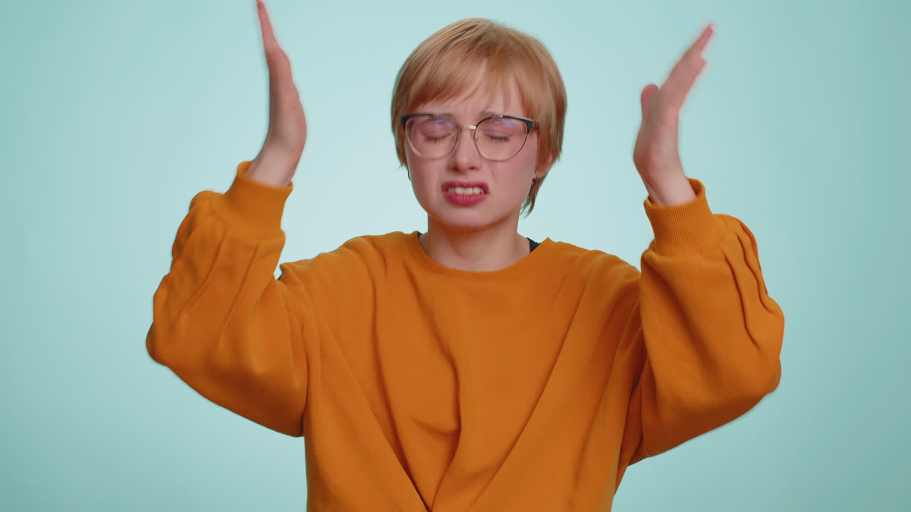 Woman fingers crossed loses becoming surprised by lottery results bad fortune loss unlucky news