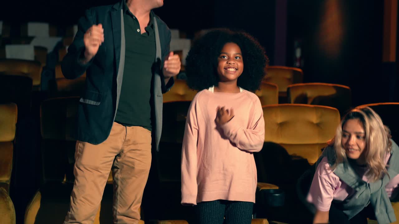 Couples and children and clapping after the movie