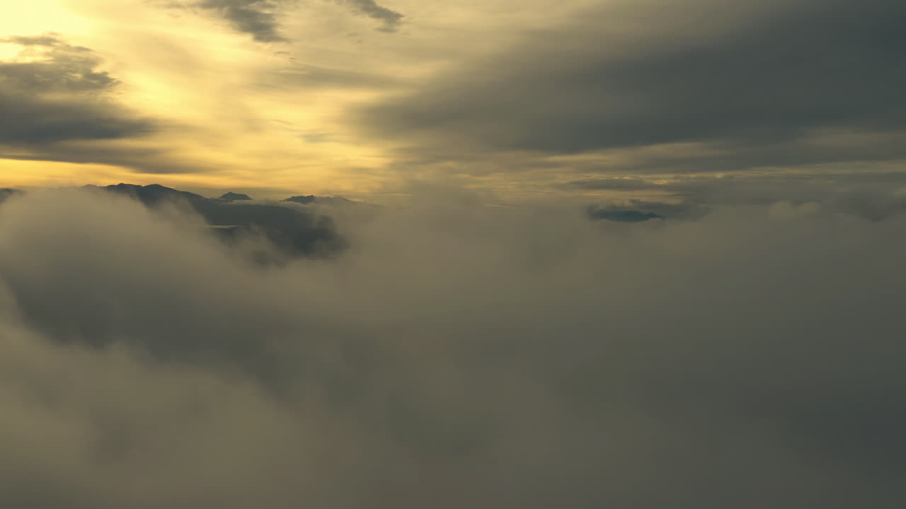 Sunrise or Sunset over Mountains and Clouds