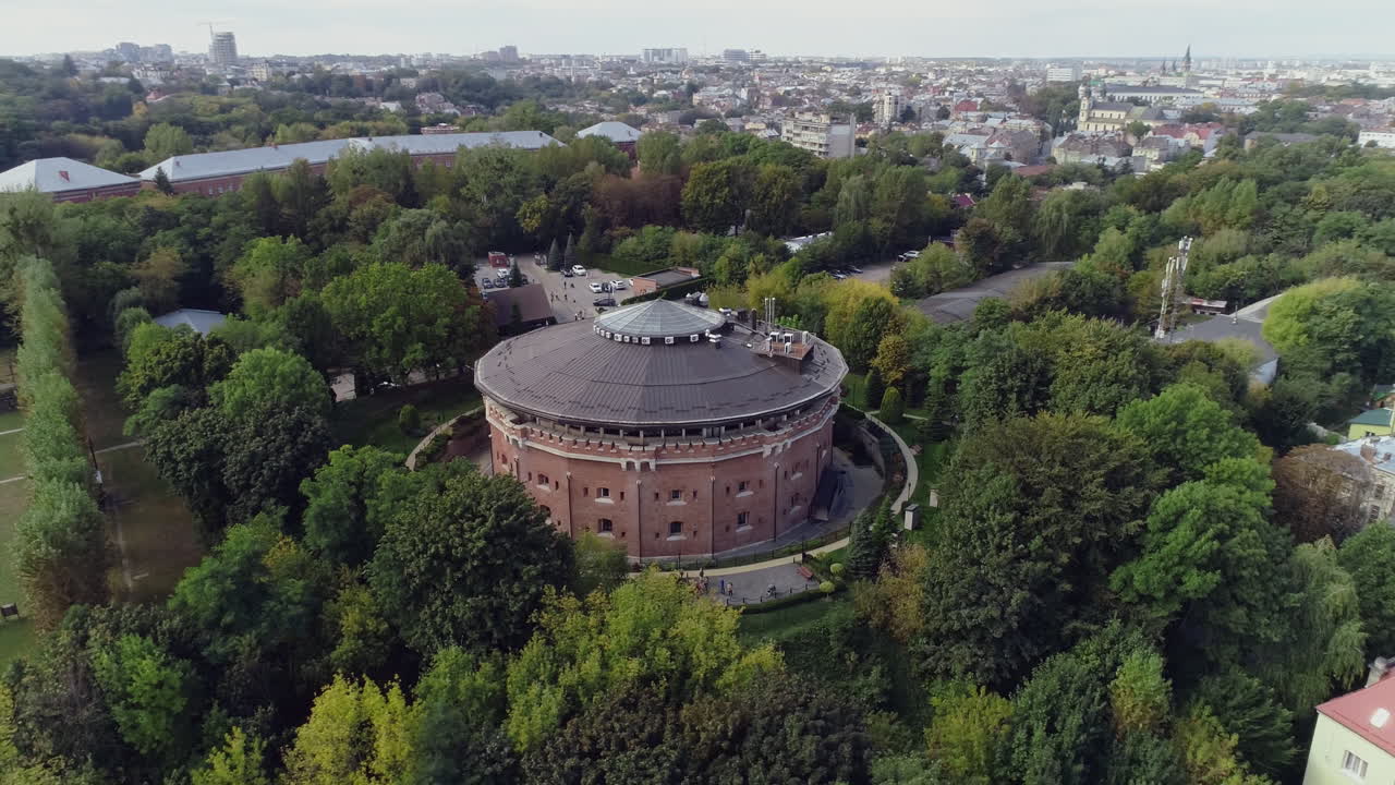 Aerial View of a Round Building in a Park