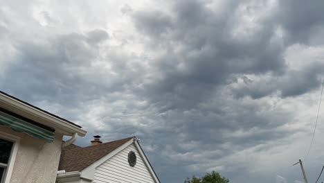 time lapse of storm clouds over house