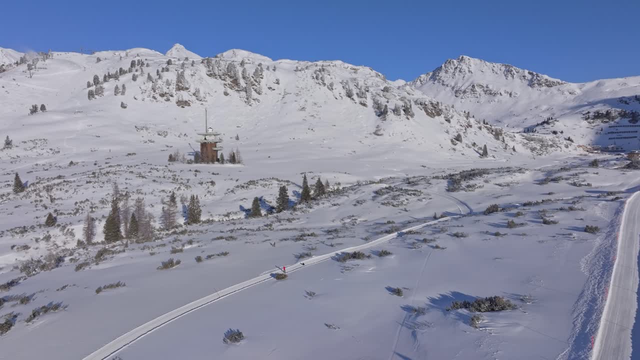 Crowded ski slope with lift lines and skiers in Obertauern, Austria